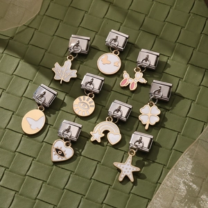 Italian charm links in stainless steel with colorful enamel clover and rainbow patterns