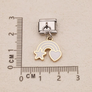 Italian charm link with rainbow and star patterns shown against a centimeter scale