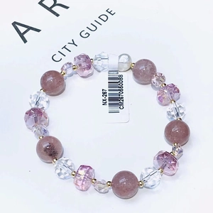 Elegant amethyst crystal bracelet with strawberry quartz beads and gold spacers on white background