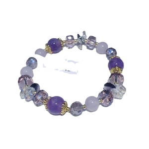 Handcrafted purple amethyst beaded bracelet with gold accents on a plain white background