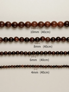 Close-up of 4mm to 10mm matte rosewood beads for DIY jewelry making and bracelets