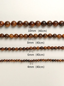 Comparison of 4mm to 10mm natural rosewood beads showing texture and wood grain