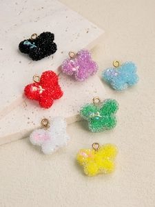 Détails des pendentifs papillon en résine texturée sucre avec anneaux dorés métalliques