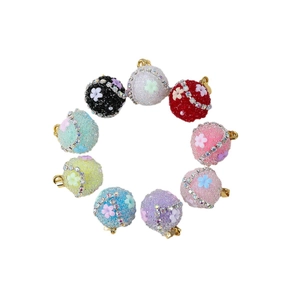 Set of 9 colorful sugar-textured round pendant charms with flower and crystal accents