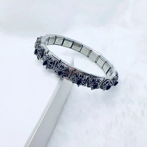 Gothic stainless steel elastic bracelet featuring 3D black spider charms on white fur decor