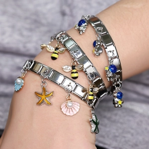 Italian charm bracelets in stainless steel with bee, astronaut, shell and starfish charms