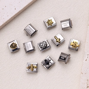 Vintage stainless steel Italian charms set featuring cross, rose, and cupid bear designs