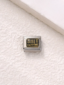 Macro detail of Italian style stainless steel charm with Shit Happens gold lettering