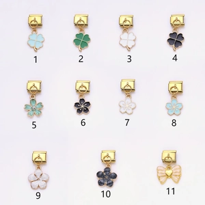 Italian modular charm links in gold alloy featuring clover and cherry blossom designs