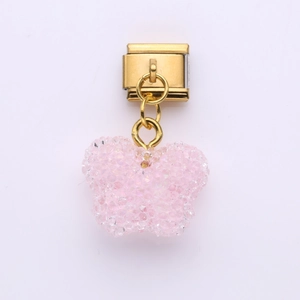 Detail of pink glitter butterfly charm on gold Italian modular stainless steel bracelet link