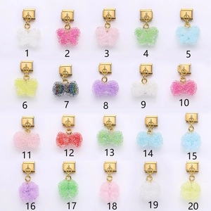 Italian modular charm bracelets featuring glitter resin butterflies and clover designs