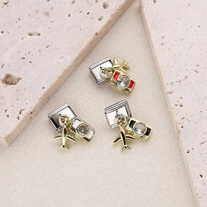 Italian charm bracelet links set featuring gold plane and camera charms on steel base