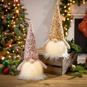 Two light-up Christmas gnomes with pink and gold sequins and glowing white beards