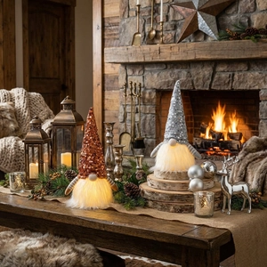 Close-up of glowing Christmas gnomes with warm LED lights on a festive fireplace mantel