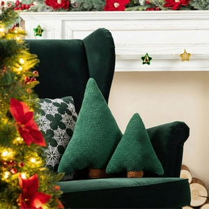 Christmas tree shaped plush pillows in green sherpa fabric on an elegant velvet sofa