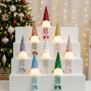 Group display of colorful glowing sequin Christmas gnomes in a festive home setting