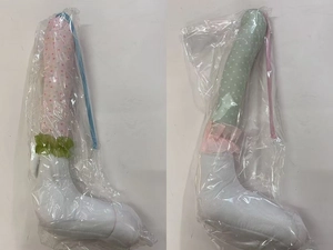 Detail of Easter plush bunny legs in pink and green polka dots with lace trim decor