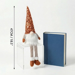 Detail shot of a 47cm Christmas gnome with sequins hat and striped legs on display
