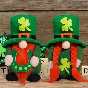 Saint Patrick's Day gnomes pair with clover hats and shamrock decor on wooden background