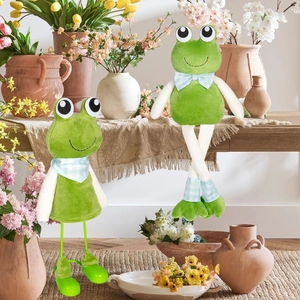 Cute long-legged frog plush ornaments with check bows in a cozy floral home setting