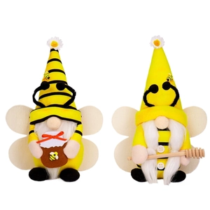 Set of two bumble bee gnomes with striped hats and honey jars for spring home decoration