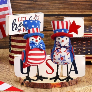 Detail of two patriotic bird figurines with stars and stripes for Independence Day decor