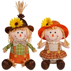 Harvest festival scarecrow couple dolls with sunflowers and plaid fabric for autumn decor