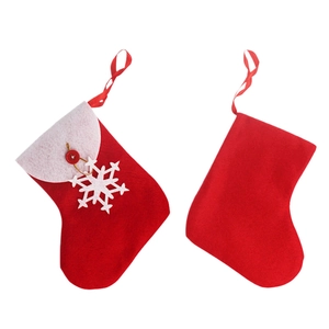Red Christmas stocking ornaments with white snowflake charm and button details