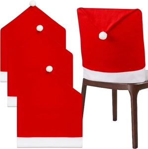 Set of 4 Christmas hat chair covers in red and white plush fabric for festive dining decor