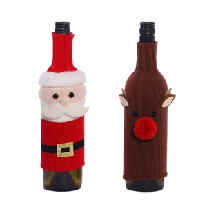 Christmas knitted wine bottle covers with Santa Claus and reindeer designs on white background
