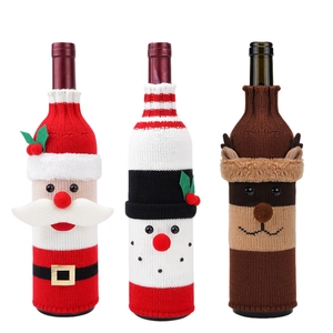 Three-piece Christmas knitted wine bottle covers with Santa, Snowman and Reindeer motifs