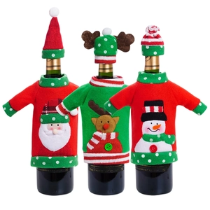 Three Christmas wine bottle covers featuring Santa Claus, reindeer, and snowman designs
