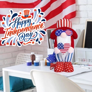Independence Day gnome plush with star glasses and heart decor on a white table