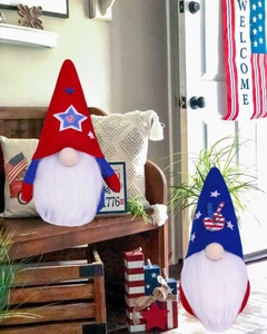 Detail of USA Independence Day gnomes with stars and stripes on a wooden bench