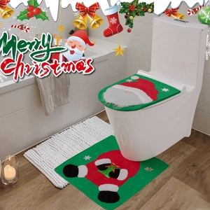 Detail of Christmas Santa gnome toilet cover and U-shaped non-slip mat for bathroom decor