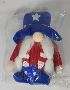 Detailed view of patriotic 4th of July gnome plush toy with stars and stripes in polybag