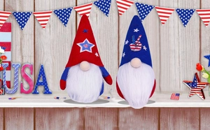 Patriotic gnome pair with red white blue stars and peace signs on wooden background