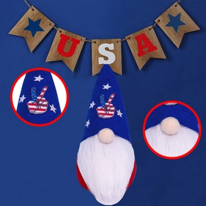 Detail of USA gnome decoration with red white and blue star patterns and peace gesture