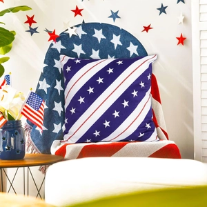 Detail of USA flag throw pillow on a chair with festive stars and stripes decorations