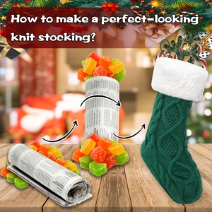 Detail of green knit Christmas stocking with white faux fur cuff on a wooden background