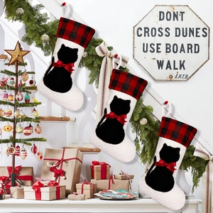 Three-piece quilted white Christmas stockings with red plaid cuff and black cat motif