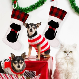 Festive red and black plaid Christmas stockings with dog silhouettes and pet sweaters