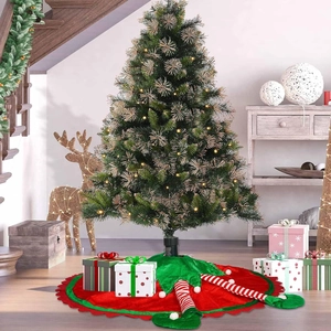 Detailed scalloped edge of Christmas tree skirt with plush 3D elf legs and pom-pom boots