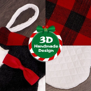 Detail of red black buffalo plaid Christmas stocking with 3D handmade bow and cotton loop