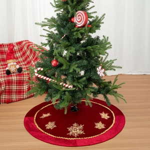 Red velvet Christmas tree skirt featuring golden snowflake embroidery and sequins