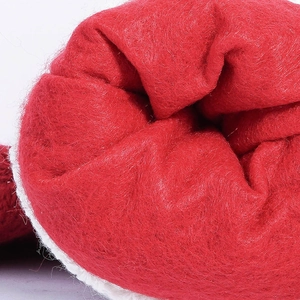 Red and white knit Christmas stocking decoration with soft plush trim details