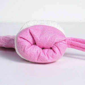 Detail of pink faux shearling headband with white knitted trim for winter warmth