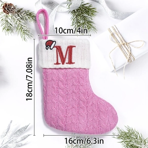 Pink knitted Christmas stocking with embroidered letter M and dimensions 18x16cm