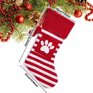Detailed size chart of red and white striped knit Christmas stocking with paw print