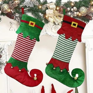 Set of two festive Christmas elf stockings with bells and gold buckles for tree decor